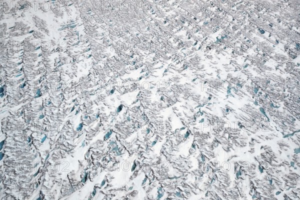 Aerial view of meltwater on the Greenland ice sheet, Arctic landscape, frozen wilderness, glaciers and snow-covered terrain, Climate change, Global warming, Greenland, North America