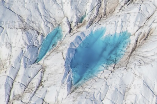 Aerial view of meltwater on the Greenland ice sheet, Arctic landscape, frozen wilderness, glaciers and snow-covered terrain, Climate change, Global warming, Greenland, North America