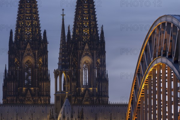 Evening atmosphere, Cologne Cathedral illuminated with LED lamps and the Hohenzollern Bridge, Cologne, North Rhine-Westphalia, Germany
