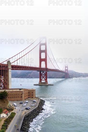1937 Golden Gate Bridge in the mist, red Art Deco suspension bridge linking San Francisco to Marin County, California, United States