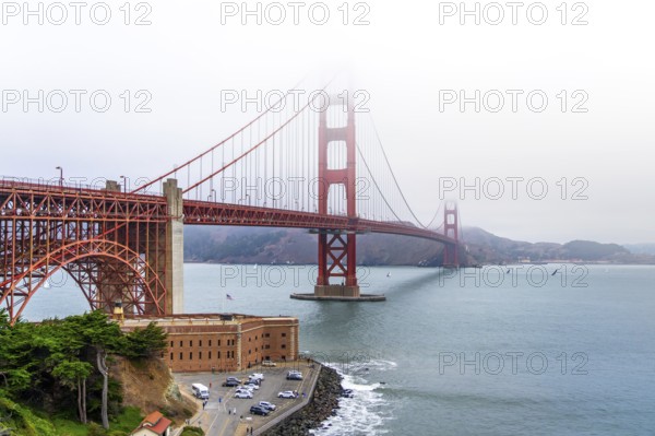 1937 Golden Gate Bridge in the mist, red Art Deco suspension bridge linking San Francisco to Marin County, California, United States