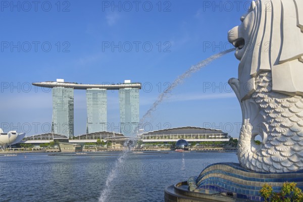 The Merlion fountain and Marina Bay Sands, MBS, luxury 5-star hotel and integrated resort in Downtown Core of the city Singapore, Southeast Asia