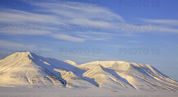 Snow covered mountain Operafjellet, Opera Mountain on the north side of Adventdalen near Longyearbyen in spring, Spitsbergen, Svalbard, Norway