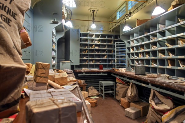 Interior of Belgian postal carriage for transporting and sorting mail at Train World, railway museum in Schaerbeek, Schaarbeek, Belgium
