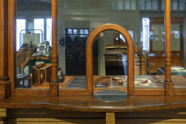 Vintage ticket counter in former ticket hall at the Schaerbeek railway station at Train World, railway museum in Schaarbeek, Brussels, Belgium