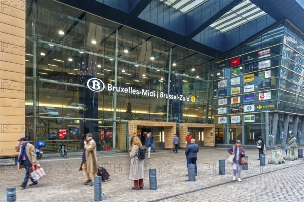 Entrance and travelers, commuters, tourists leaving the NMBS Brussels-South railway station, Gare de Bruxelles-Midi in Brussels, Belgium