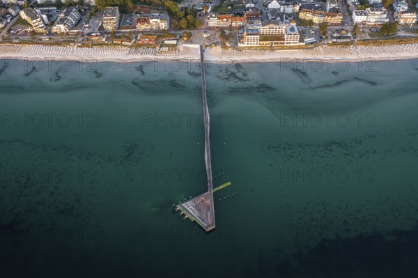 Aerial view over Seebrücke, pier and sandy beach at seaside resort Scharbeutz along the Baltic Sea, Ostholstein, Schleswig-Holstein, Germany