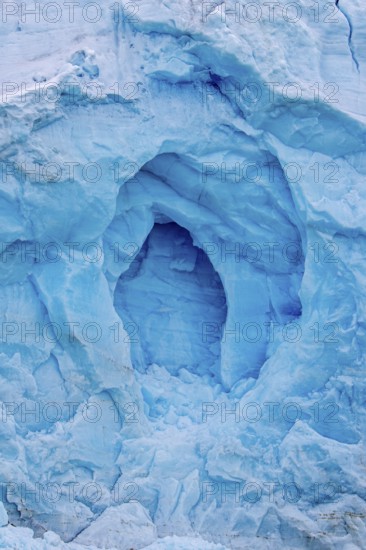 Blue ice wall of Monacobreen, glacier in Haakon VII Land which debouches into Liefdefjorden, Spitsbergen, Svalbard, Norway