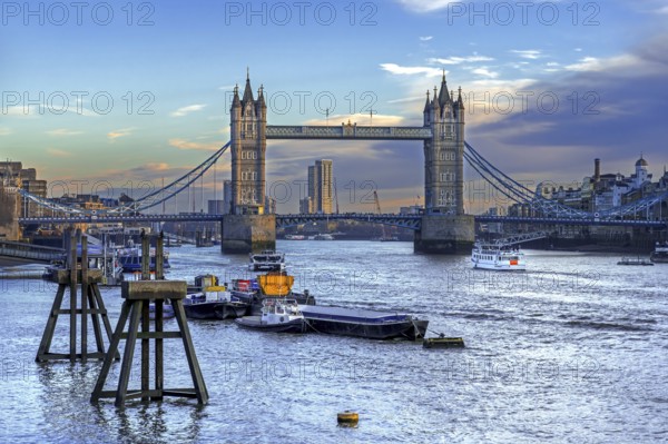 19th century Tower Bridge, neo-Gothic bascule / suspension bridge crossing the River Thames in the capital city London, England, UK