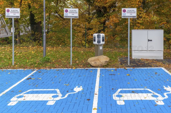 Parking area with empty public charging station / loading points from KEBA, network of chargers for electric vehicles / cars in Lower-Saxony, Germany