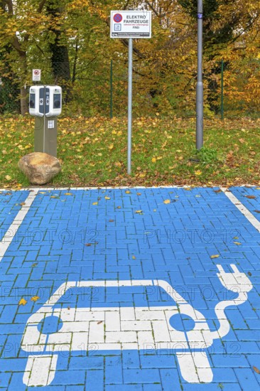 Parking area with empty public charging station / loading point from KEBA, network of chargers for electric vehicles / cars in Lower-Saxony, Germany