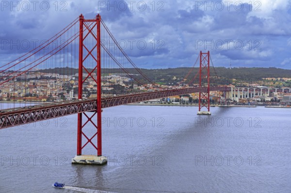 Ponte 25 de Abril / 25th of April Bridge, red suspension bridge over the Tagus River connecting the city of Lisbon / Lisboa to Almada, Portugal
