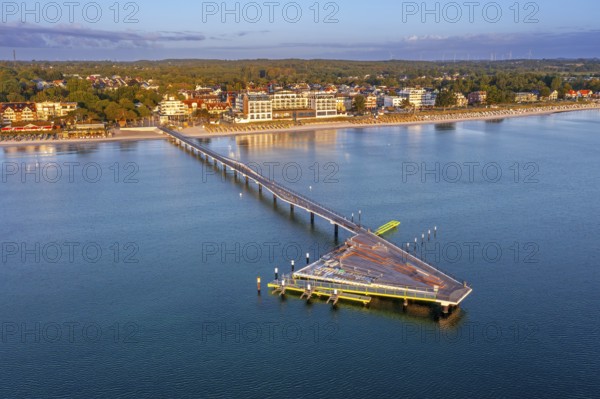 Aerial view over Seebrücke / pier and sandy beach at seaside resort Scharbeutz along the Baltic Sea, Ostholstein, Schleswig-Holstein, Germany