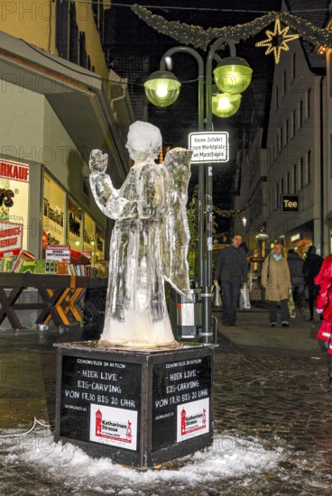 Eisengel, an ice sculpture created during Ice Carving Street Action as part of the long shopping night in downtown Reutlingen, Baden-Württemberg, Germany, for editorial use only