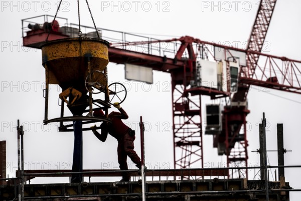 Construction site, concreting work, on a large construction project, apartments and commercial premises, symbolic image of the construction industry