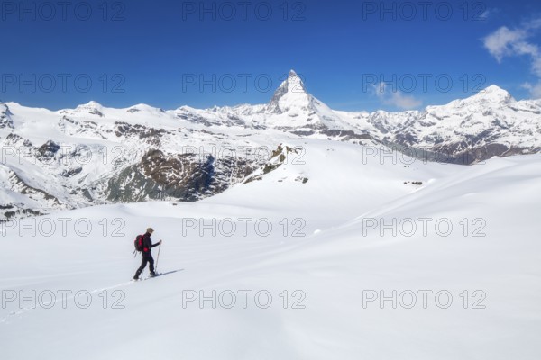 Snowshoeing in the Gornergrat region with views of the surrounding mountains and the Matterhorn, Zermatt, Valais Canton, Switzerland