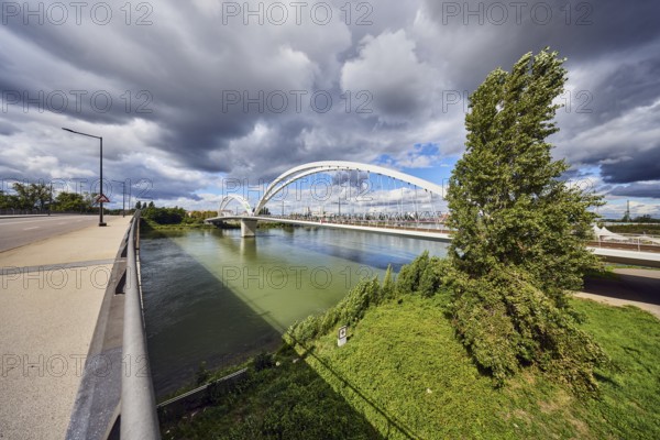 Europe bridge, car and pedestrian bridges, Beatus Rhenanus bridge, pedestrian and tram bridge, architect Marc Barani, Rhine river, border between Germany and France, sidewalk, cycle path, street, lantern, metal railing, trees, meadow, rainy mood, blue partly cloudy sky, cumulus congestus clouds, Strassburger Straße, Kehl, Upper Rhine lowlands, Ortenaukreis, Baden-Württemberg, Germany