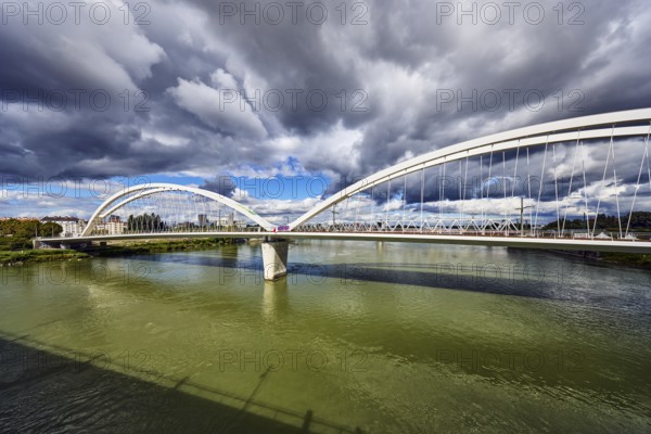 Beatus-Rhenanus bridge, pedestrian and tram bridge, architect Marc Barani, Rhine river, border between Germany and France, border river, rainy mood, partly cloudy blue sky, cumulus clouds, cumulus congestus clouds, image processing brightnesses and contrasts, Kehl, Upper Rhine plain, Ortenau district, Baden-Württemberg, Germany