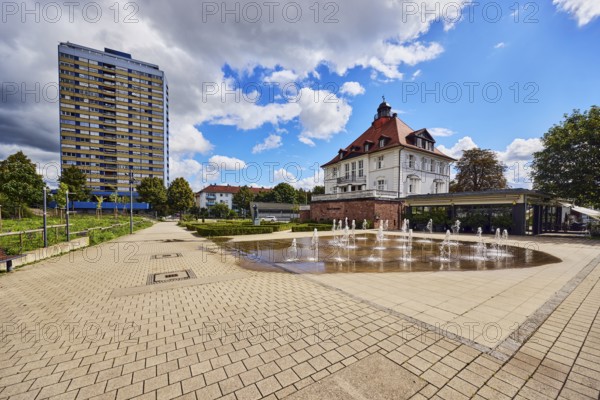 Villa Schmidt restaurant, park, fountain, hedge, lawn, paths, residential buildings, residential high-rise building, trees, blue partly cloudy sky, cumulus clouds, cumulus congestus clouds, Kehl, Upper Rhine Plain, Ortenaukreis, Baden-Württemberg, Germany