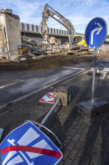 Demolition of the 120 meter long motorway bridge of the A516, across Teutoburger Straße in Oberhausen-Sterkrade, the bridge, built in 1970 was severely damaged, traffic continues to roll on the still existing West Bridge, after the demolition, the eastern part is rebuilt using a process unique in the world, 40 meter long precast concrete beams are assembled one after the other, reducing the construction period from 24 to 7 months after the completion of this bridge Will the western part also be rebuilt, North Rhine-Westphalia, Germany