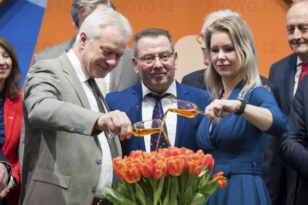 Alios Rainer (Federal Minister of Agriculture, Food and Home Affairs) and Femke Marije Wiersma (Minister of Agriculture, Food Security, Fisheries and Nature) christen the Tulip Berlin Jubilee with their drinks in the hall of the Netherlands during the opening tour of the Green Week at the exhibition grounds in Berlin on 16 January 2026. The trade fair for the agricultural and food industry will take place from 16-25 January 2026