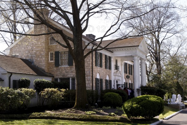 The famous Graceland estate surrounded by trees and well-kept gardens, Memphis, Tennessee, USA