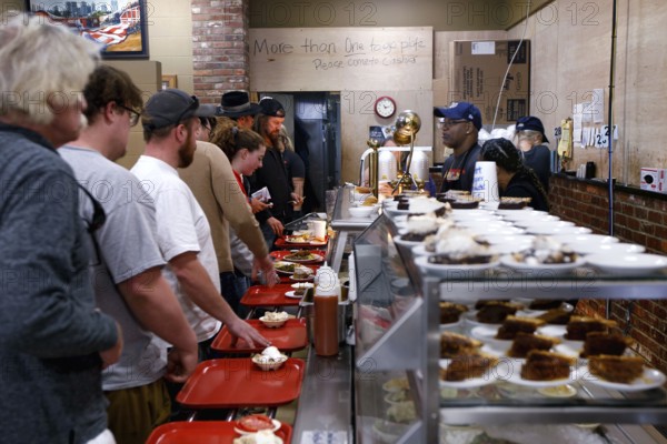 People stand in line at Arnold's Country Kitchen in Nashville, Nashville, Tennessee, USA
