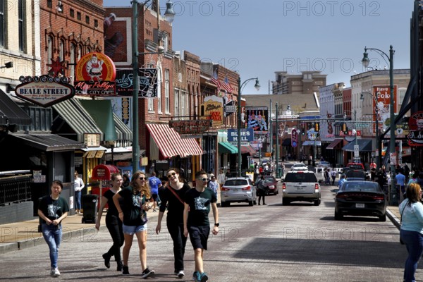 Lively walk by people on the famous Beale Street in Memphis, Memphis, Tennessee, USA