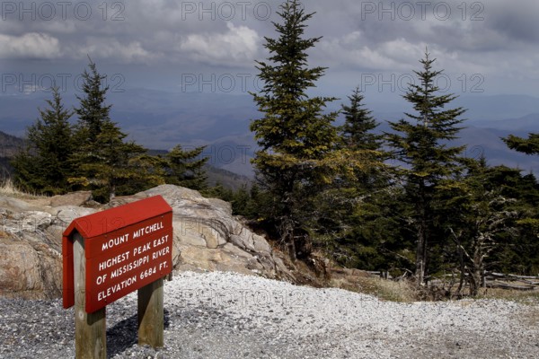 Lookout with sign and view of wooded mountains, Mount Mitchell State Park, North Carolina, USA