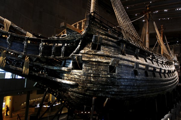 The royal flagship Vasa in the Vasa Museum presents its impressive wooden structure in low light, Stockholm, Djurgården, Sweden