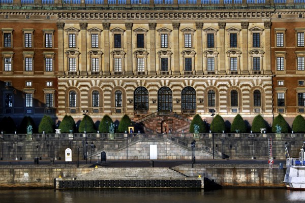 Stockholm's Royal Palace is majestically perched on the water with a detailed façade, Stockholm, Gamla Stan, Sweden