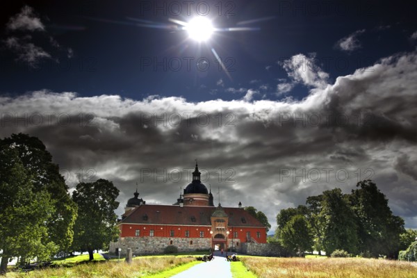 Gripsholm Castle in Mariefred in sunlight and dramatic clouds, Mariefred, Södermanland, Sweden