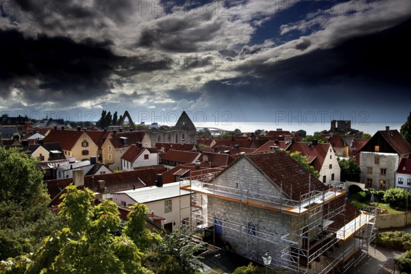 Clouds rolling over the red roofs of the historic old town, Visby, Gotland, Sweden