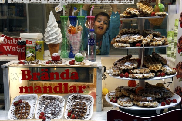Candy shop in Gamla Stan with pastries and sweet treats in the shop window, Stockholm, Gamla Stan, Sweden