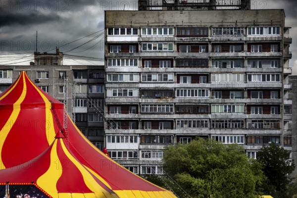 An eye-catching circus tent stands in front of a dominating prefabricated building, Kaliningrad, Kaliningrad, Russia