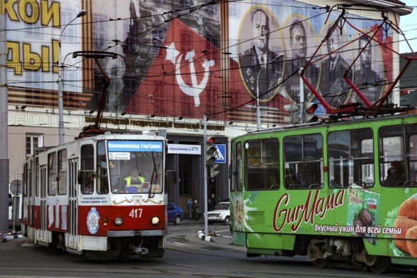 Colourful trams in front of Soviet propaganda posters, Kaliningrad, Russia