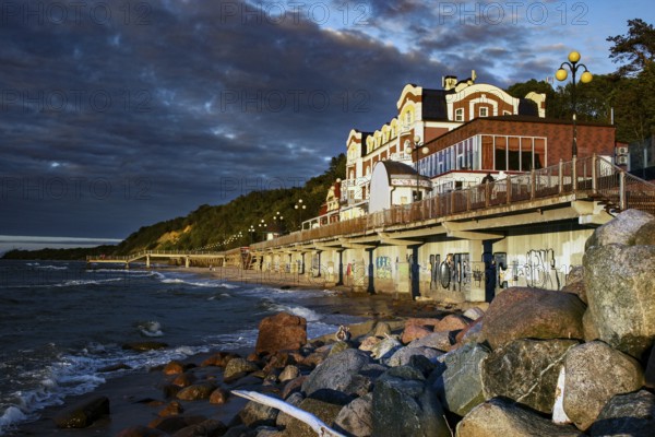 Promenade on the beach at dusk with coastal houses, Svetlogorsk, Kaliningrad, Russia