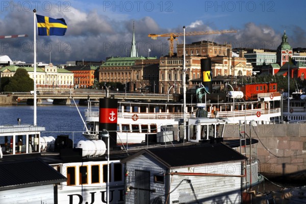 Distinctive features of Stockholm's waterways with shipping traffic and views over Strömgatan, Stockholm, Norrmalm, Sweden
