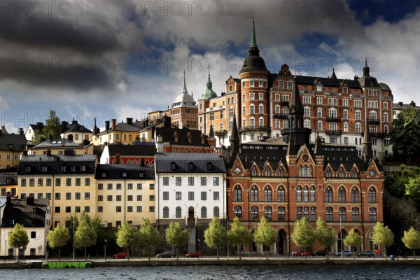 Historic buildings of Södermalm, Stockholm viewed in dramatic light from Riddarholmen, Stockholm, Södermanland, Sweden