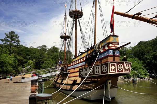 Historic sailing ship Discovery in Jamestown Settlement in front of trees on the water, Jamestown, Virginia, USA