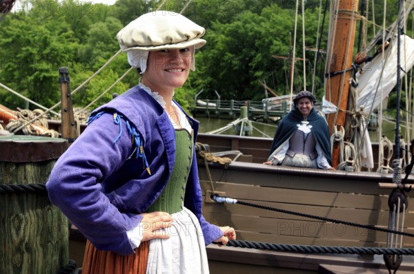 Woman in historic costume standing in a harbor in Jamestown Settlement, Jamestown, Virginia, USA