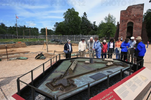 Visitors look at a model at Jamestown National Historic Site, Jamestown, Virginia, USA