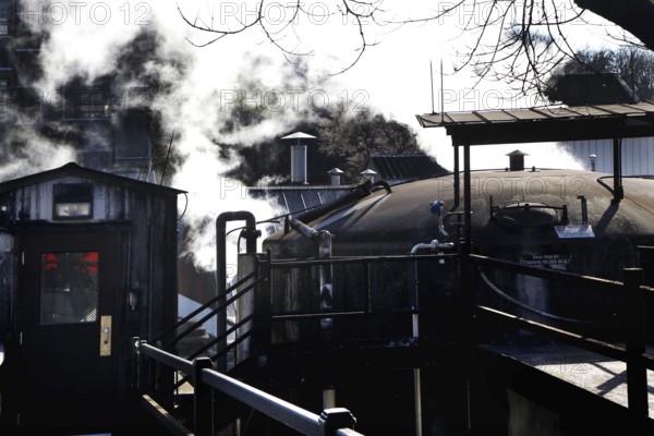 Exterior view of Jack Daniel's Distillery with smoking kettle, Lynchburg, Tennessee, USA