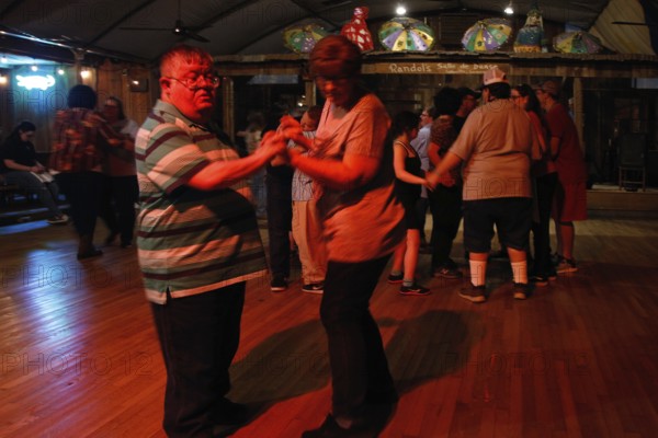 People dancing on the dance floor at Randol's restaurant, Lafayette, Louisiana, USA