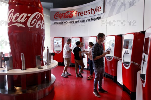Visitors to the Coca-Cola Museum tasting room in Atlanta use the Coca-Cola Freestyle vending machines, Atlanta, USA