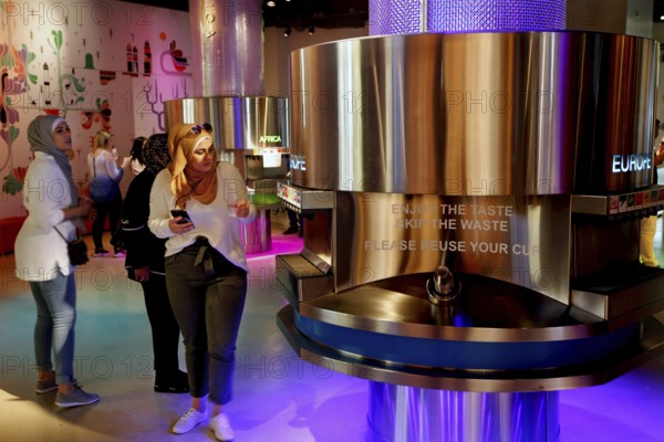Visitors to the Coca-Cola Museum tasting room in Atlanta enjoy the colorful selection, Atlanta, USA