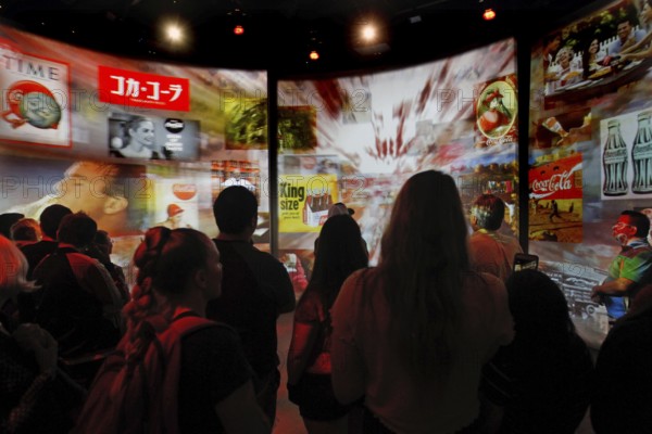 Visitors view interactive canvases at the Coca-Cola Museum in Atlanta, Atlanta, Georgia, USA