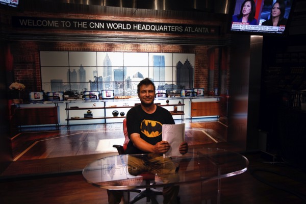 Person in the CNN studio in Atlanta in front of a news background at an anchor table, Atlanta, Georgia, USA