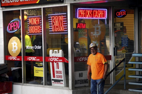 A store in downtown Atlanta illuminated with eye-catching neon signs and a Bitcoin presence, Atlanta, USA