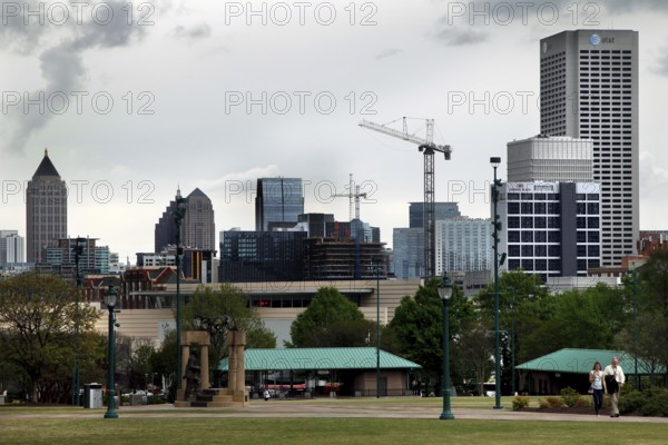 Atlanta skyline with cranes and green landscape, Atlanta, Georgia, USA